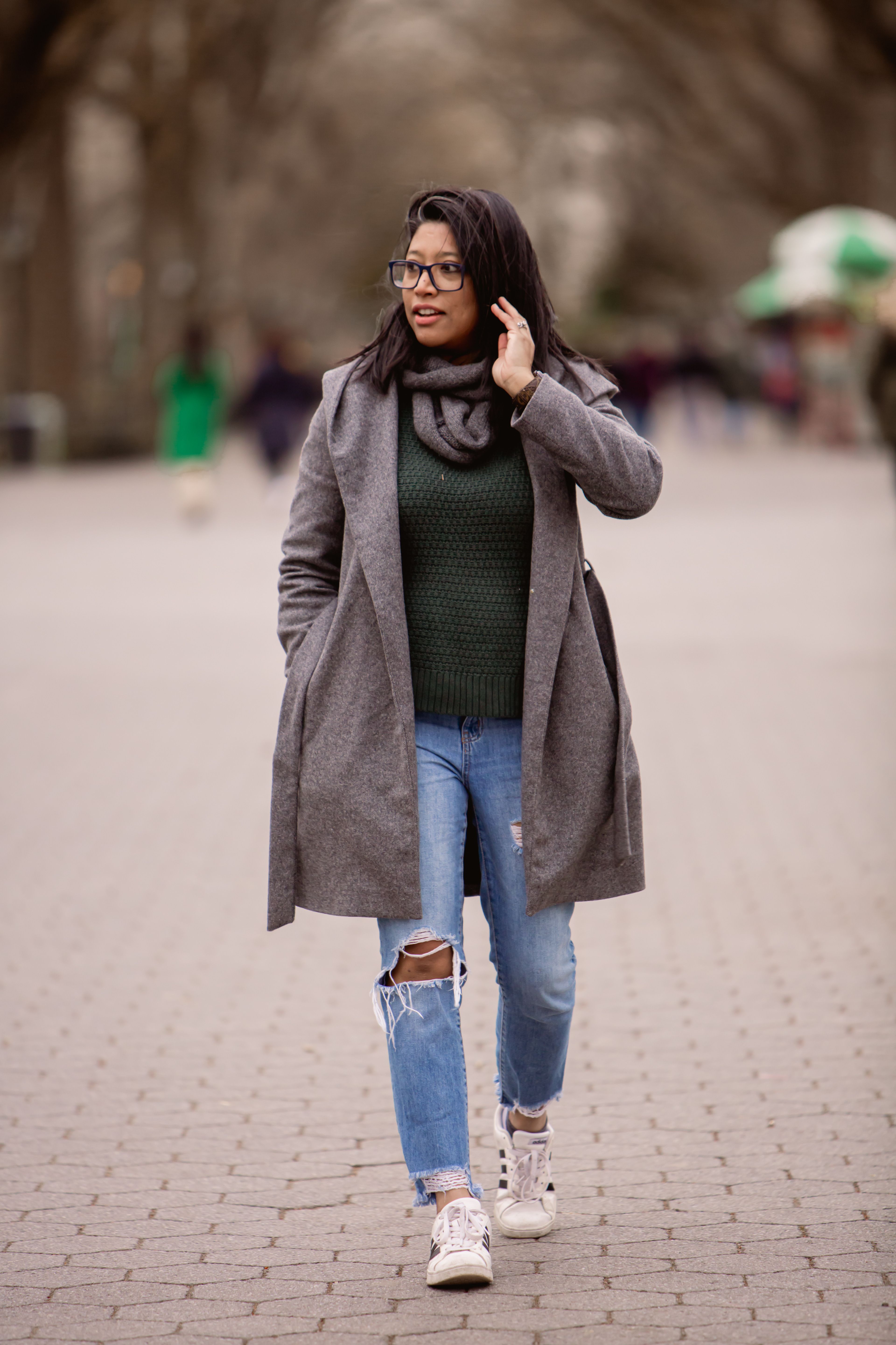 Woman in Gray Coat and Blue Denim Jeans Standing on Road · Free Stock Photo