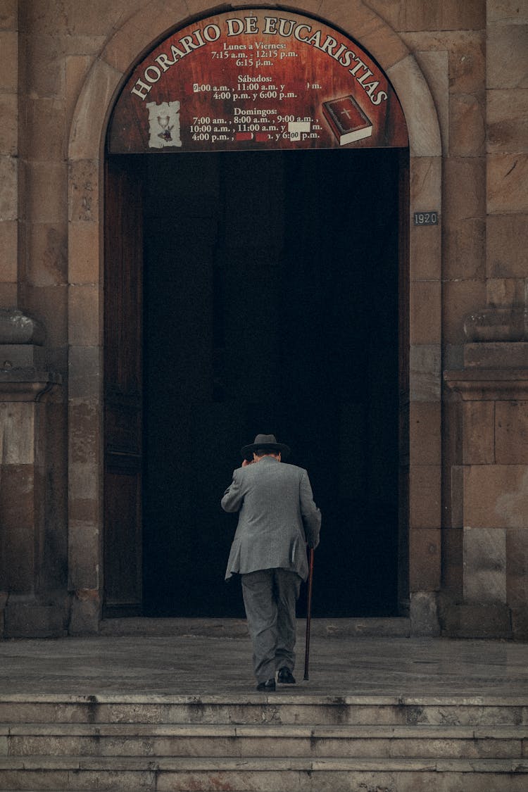 Old Man With Stick Walking To Church