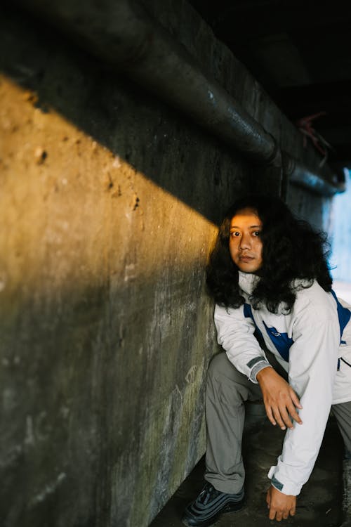 Woman Posing by a Wall