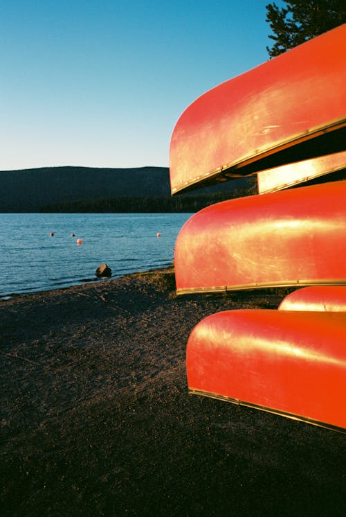 Close-up of Red Canoes by a Lakeside