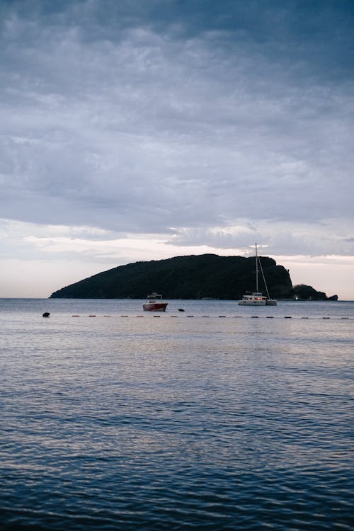 Boats on Sea Under Cloudy Sky