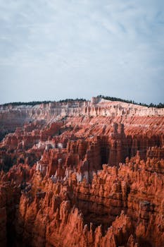 Stunning landscape of Bryce Canyon's iconic hoodoos illuminated by sunrise light.