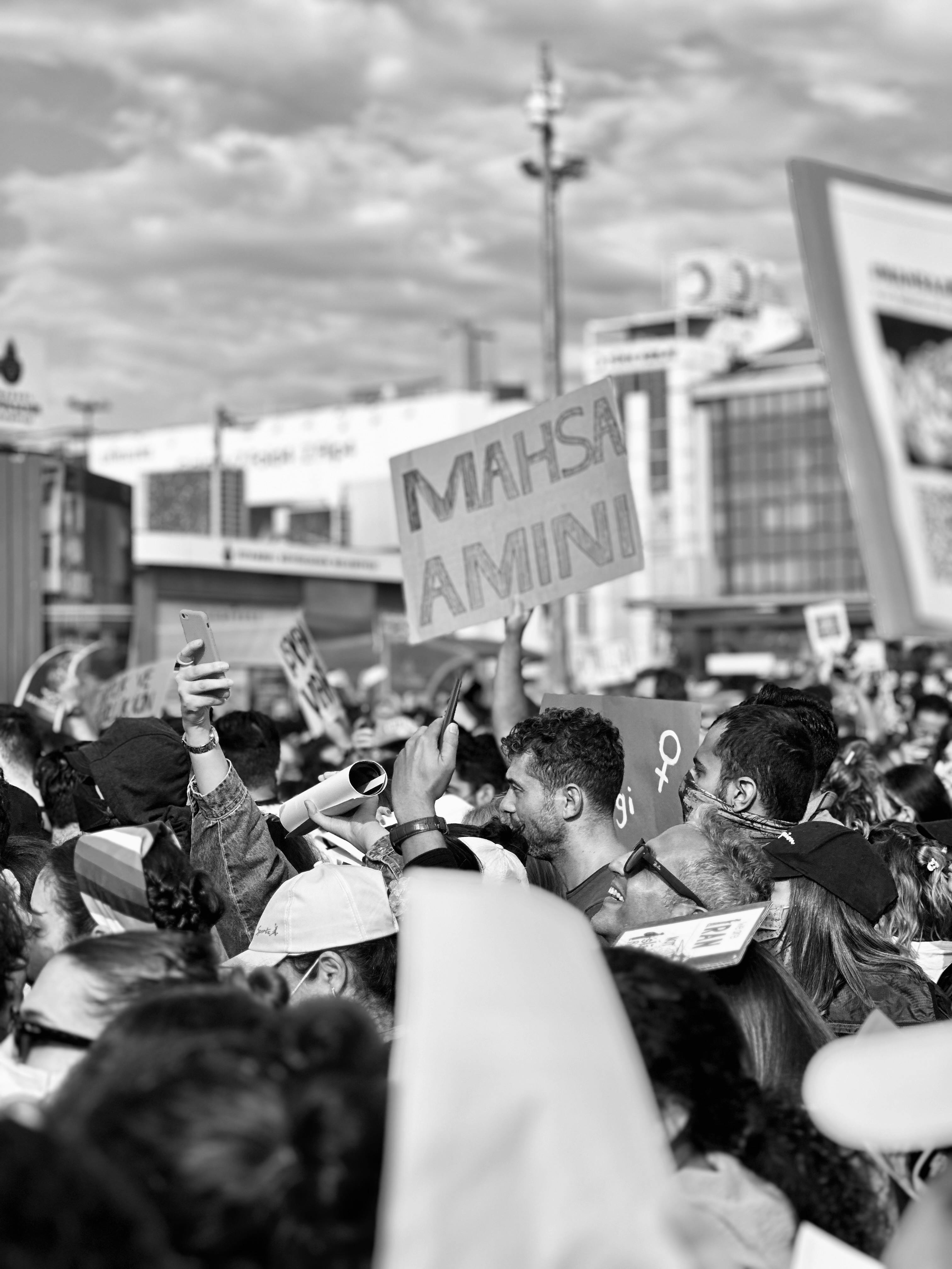 grayscale photo of people protesting in iran