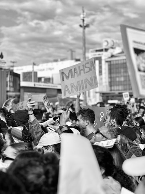 Grayscale Photo of People Protesting in Iran