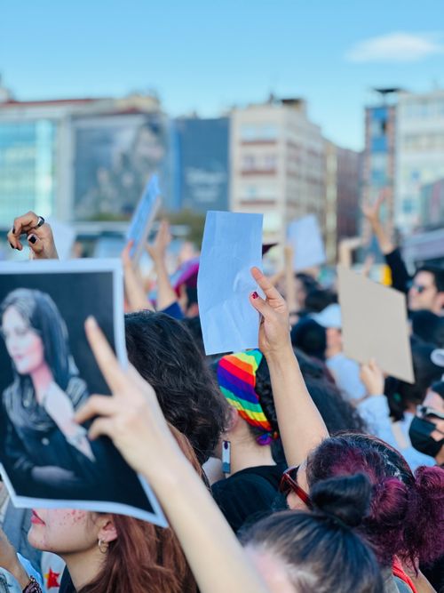 Free Energetic street protest in İstanbul with diverse crowd holding banners and posters. Stock Photo