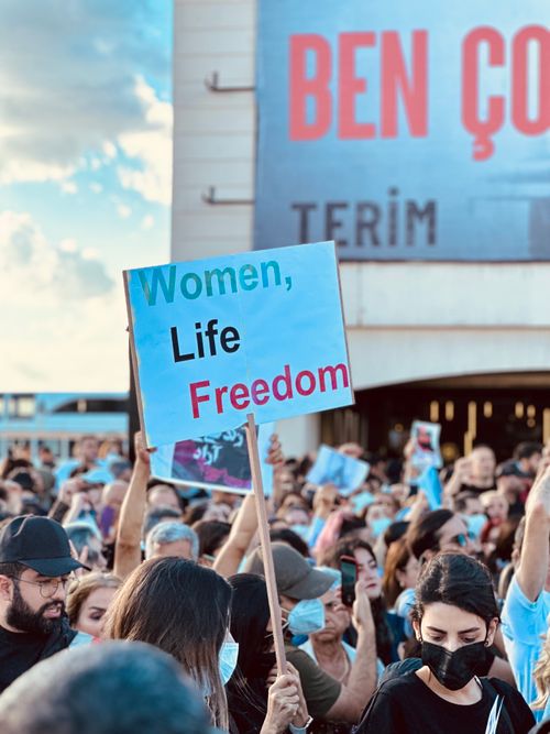 Free Crowd protesting in Istanbul with signs advocating for women's rights and freedom. Stock Photo