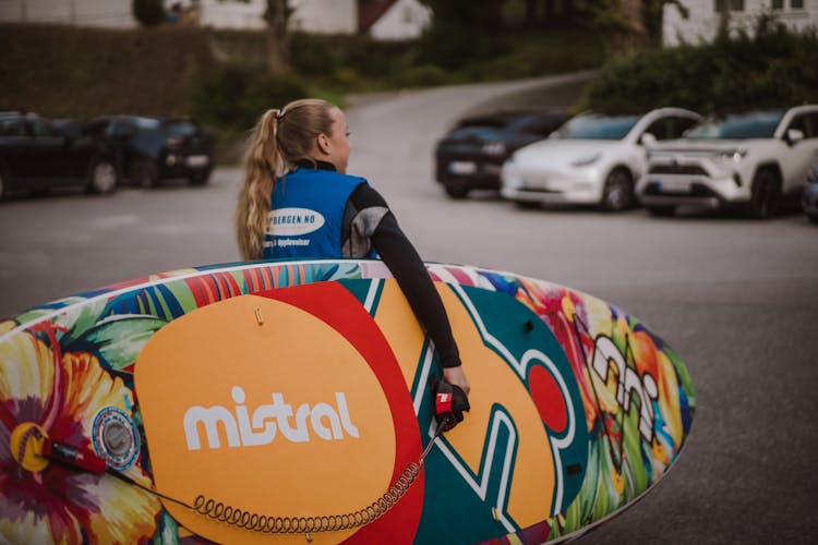 Woman Carrying Paddle Board