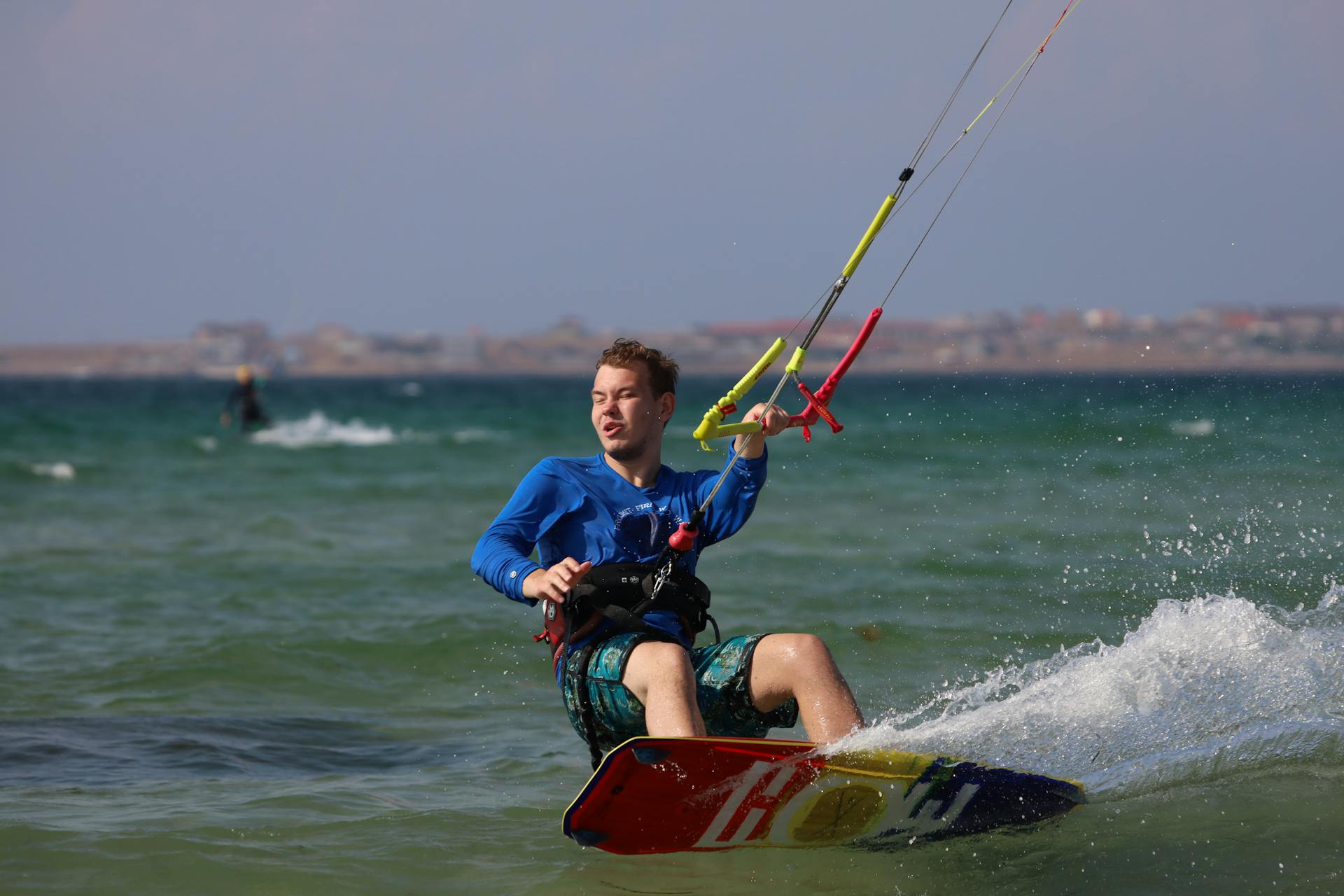 Man in Blue Long Sleeves Kitesurfing