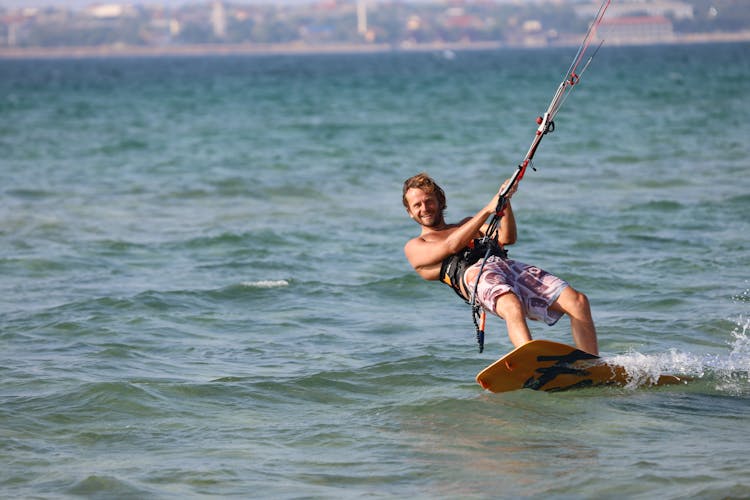 Man Wakeboarding On Sea