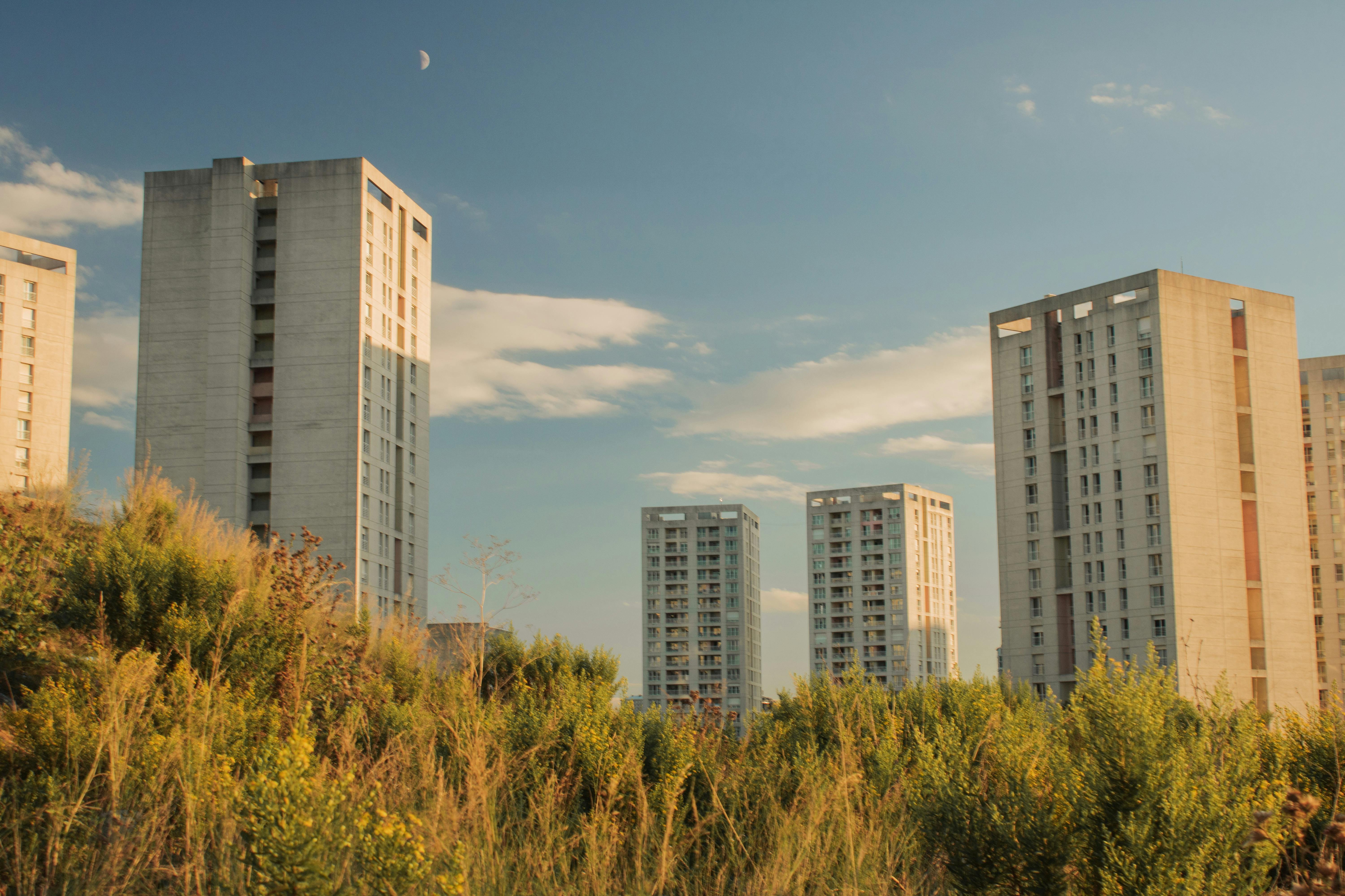 Urban landscape with modern high-rise buildings and clear blue sky.