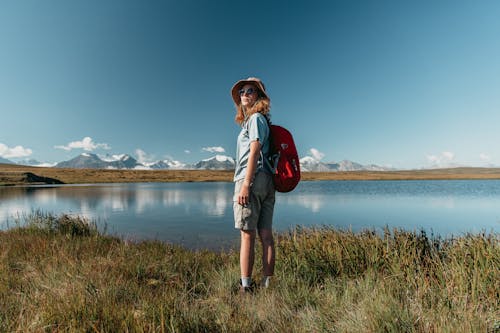 A Woman Standing Beside the River