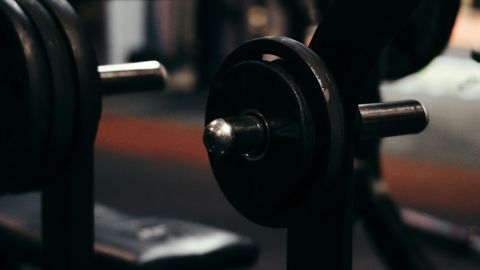An up-close view of weightlifting equipment in a modern gym setting, perfect for fitness enthusiasts.