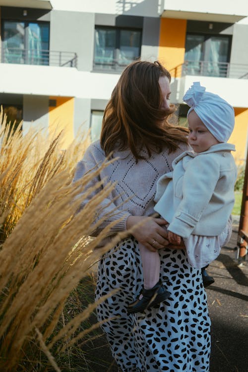 A Woman Carrying a Young Girl