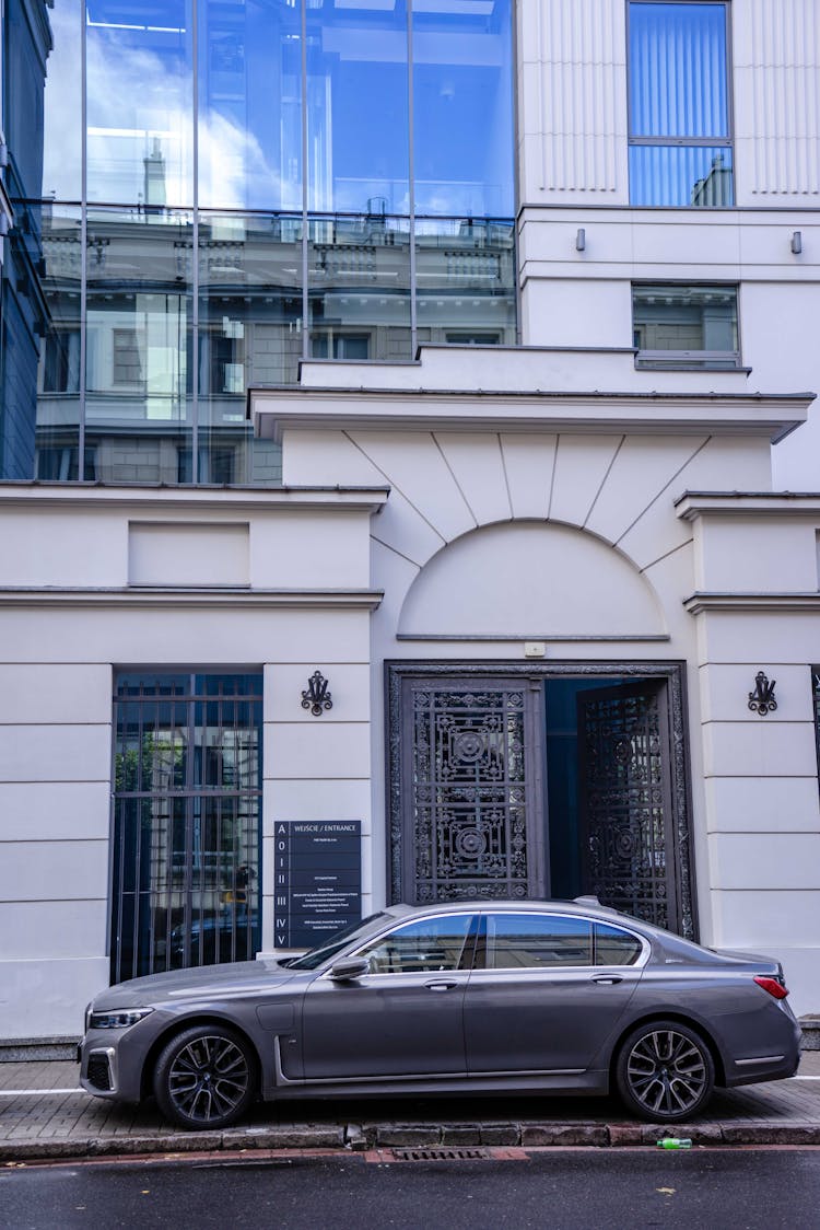 Car Parked In Front Of A Tenement House Office In Warsaw, Poland 