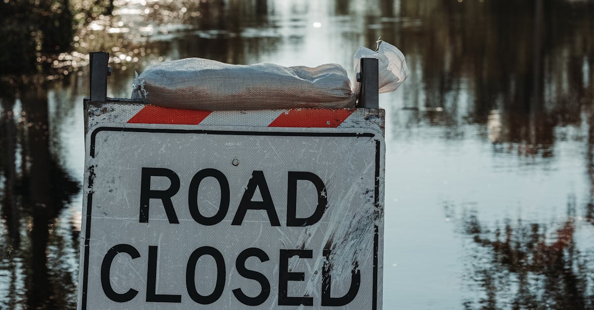 Photo by Connor Scott McManus A road closed sign blocks a flooded street after a storm.