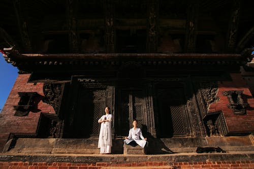 Women Praying in front of a Temple