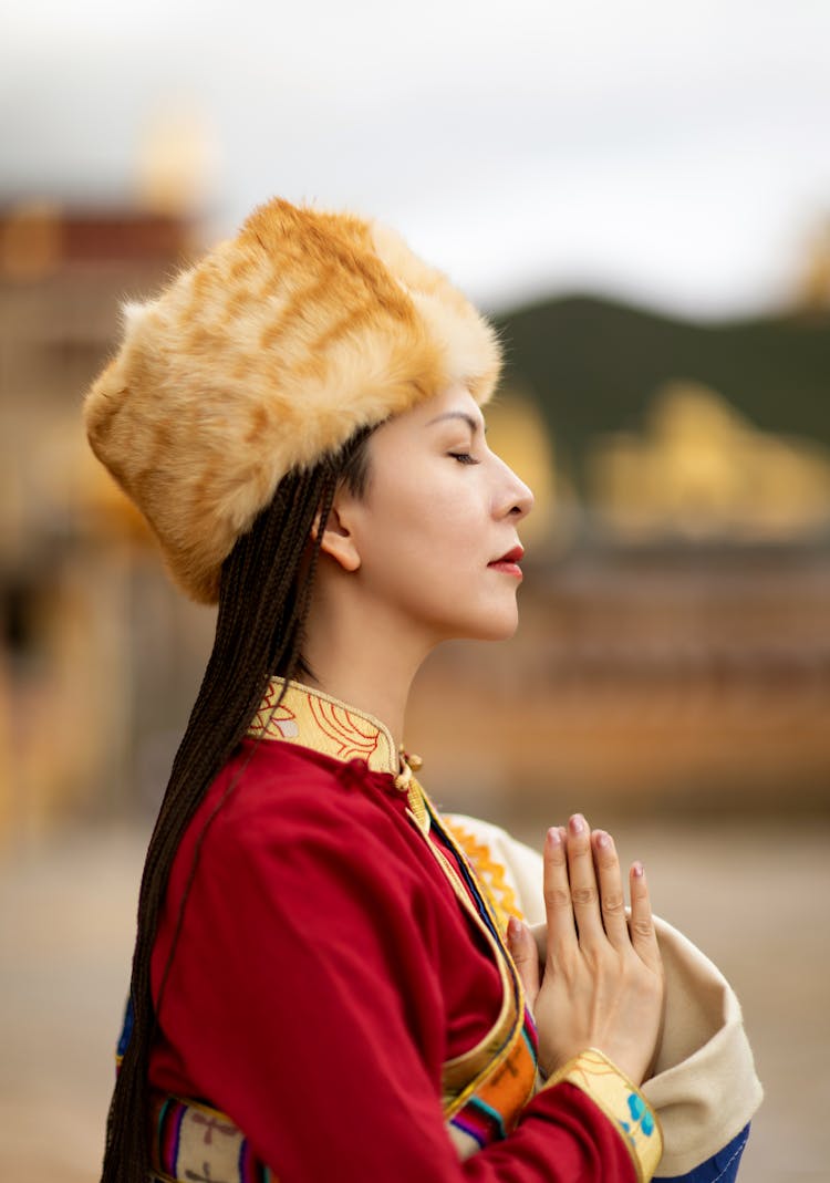 A Woman In Red Kimono Wearing Brown Fur Hat