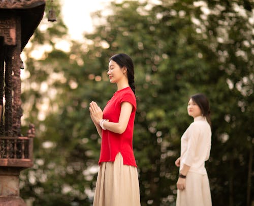 A Woman in a Red Top Praying