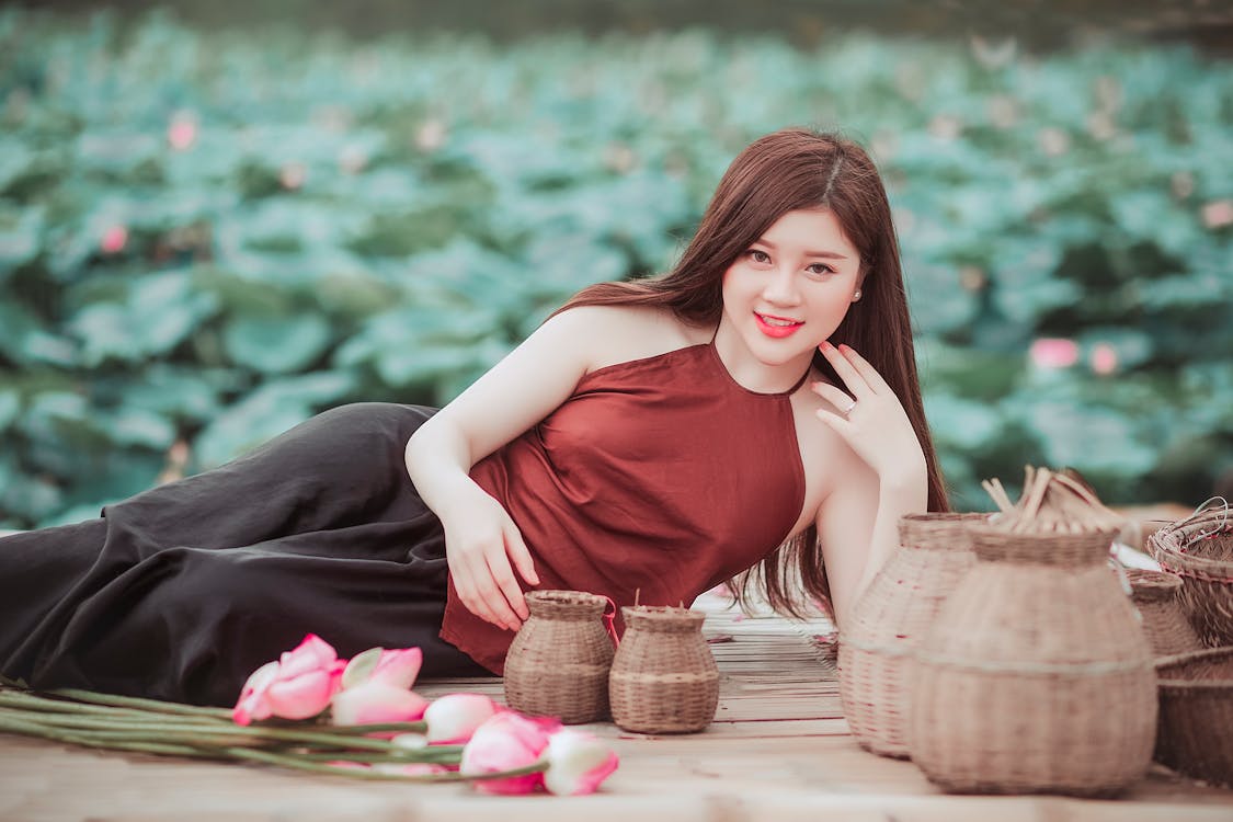 Free Woman Lying on Floor Near Baskets Stock Photo