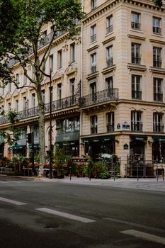 Elegant Parisian street view showcasing classic architecture and vibrant café life in the heart of Paris.
