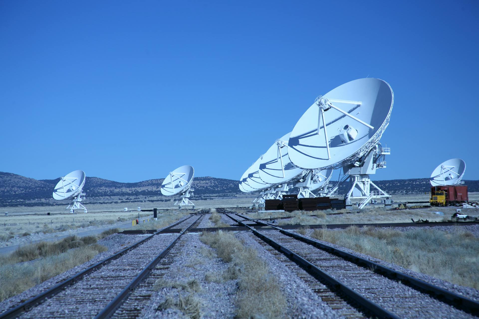 White Satellite Dishes Near the Railway