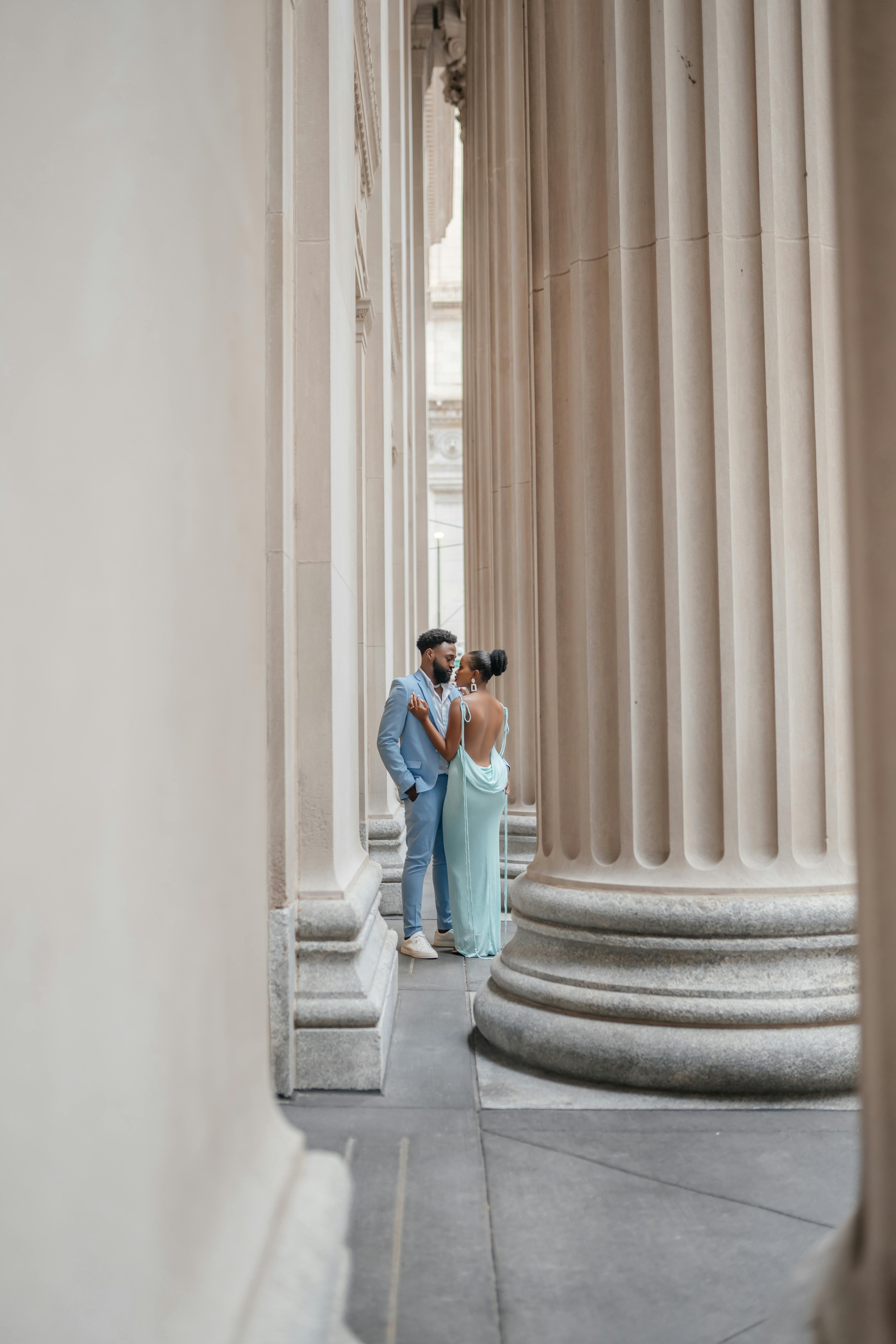 Couple Posing near Bedrocks of Old Building · Free Stock Photo