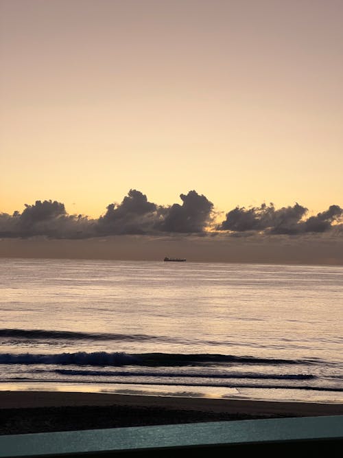 Yellowish Seascape and Gray Clouds at Dusk