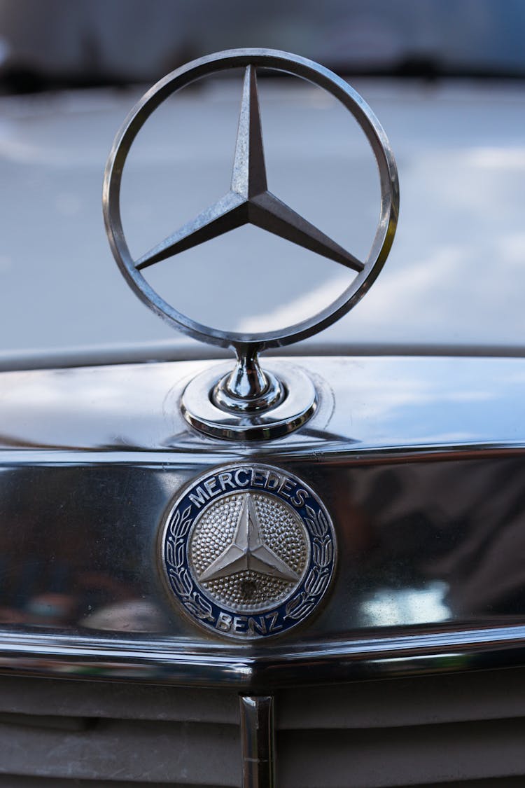 Close-up Of The Mercedes Benz Logo On The Car Hood