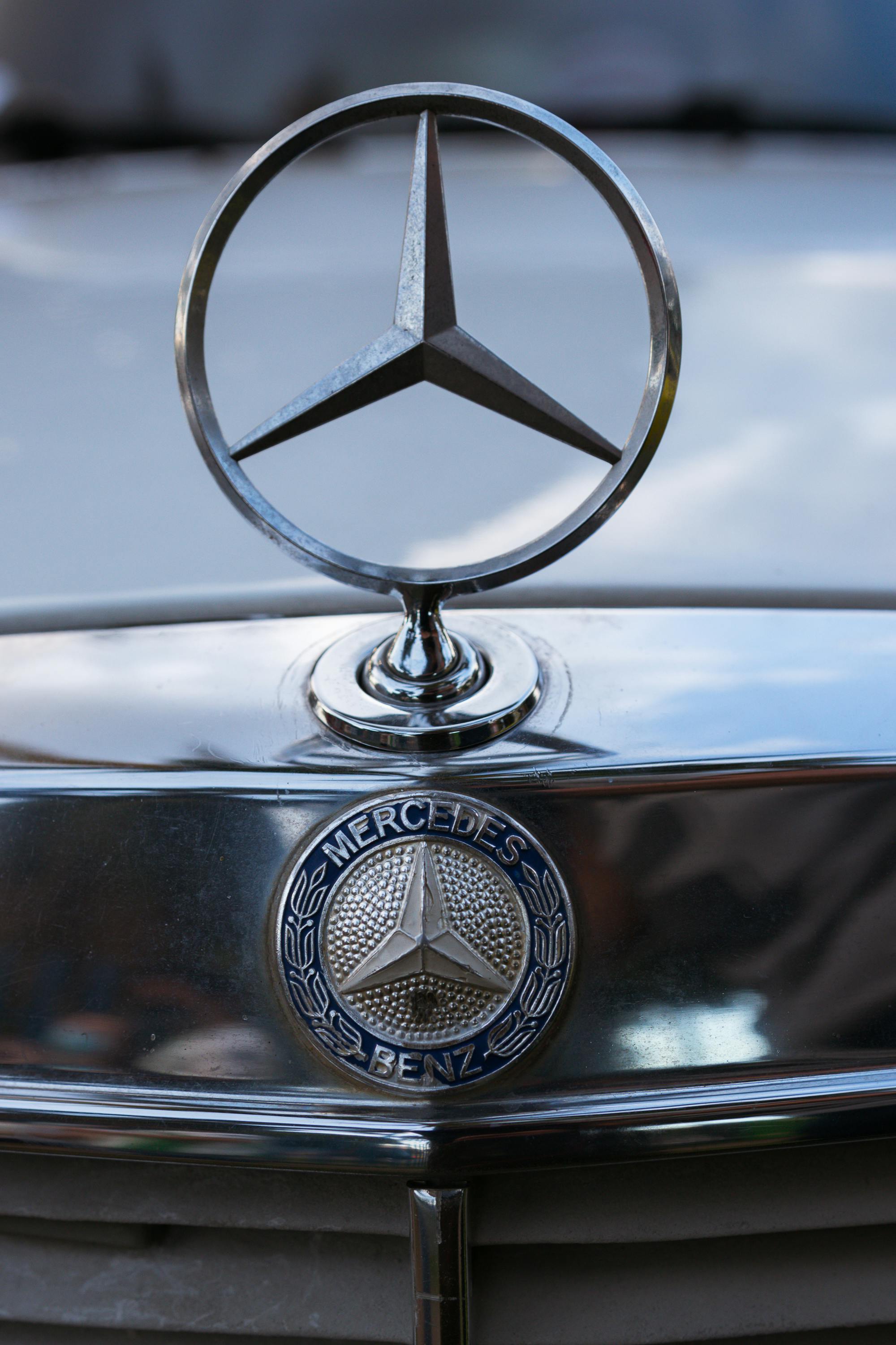 Close-up of the Mercedes Benz Logo on the Car Hood · Free Stock Photo