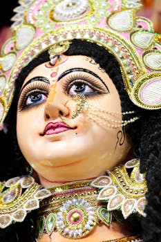Intricate close-up of a Durga idol adorned with jewelry during Durga Puja celebrations in Patna, India.