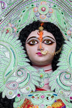 Close-up of a colorful and intricately decorated Durga idol showcasing traditional craftsmanship.