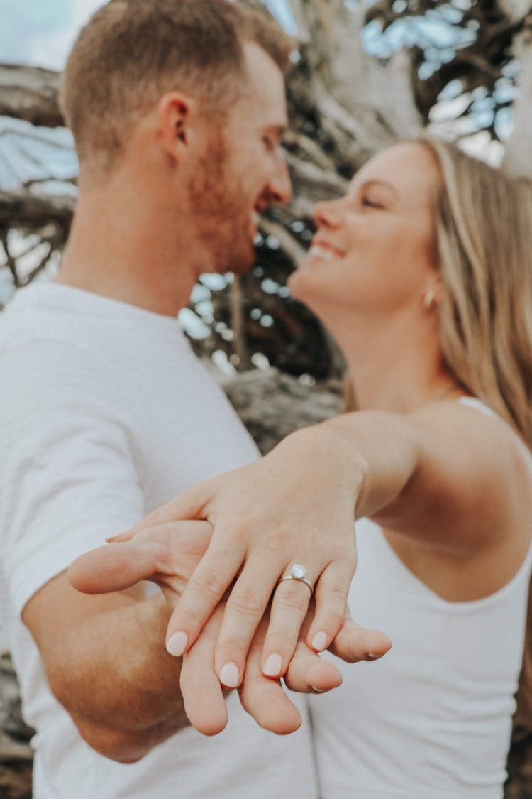 Couple Standing Face To Face Smiling