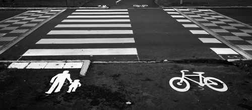 Free Black and white photo of a pedestrian and bicycle crossing with clear road markings. Stock Photo