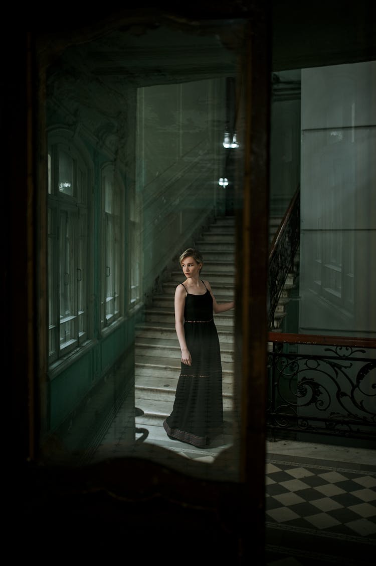 Woman In Dress Near Stairs