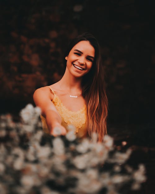 Photo of Beautiful Woman in Yellow Top