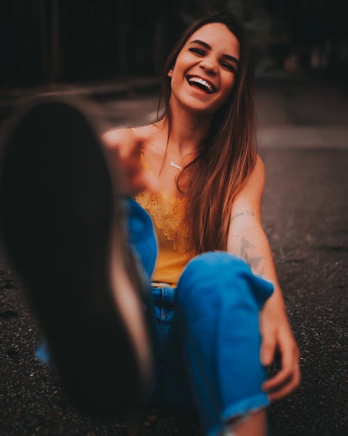 A Woman Sitting on the Street