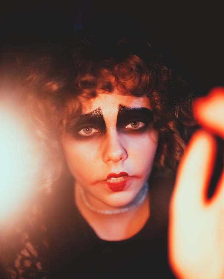 Woman With Curly Hair In Makeup