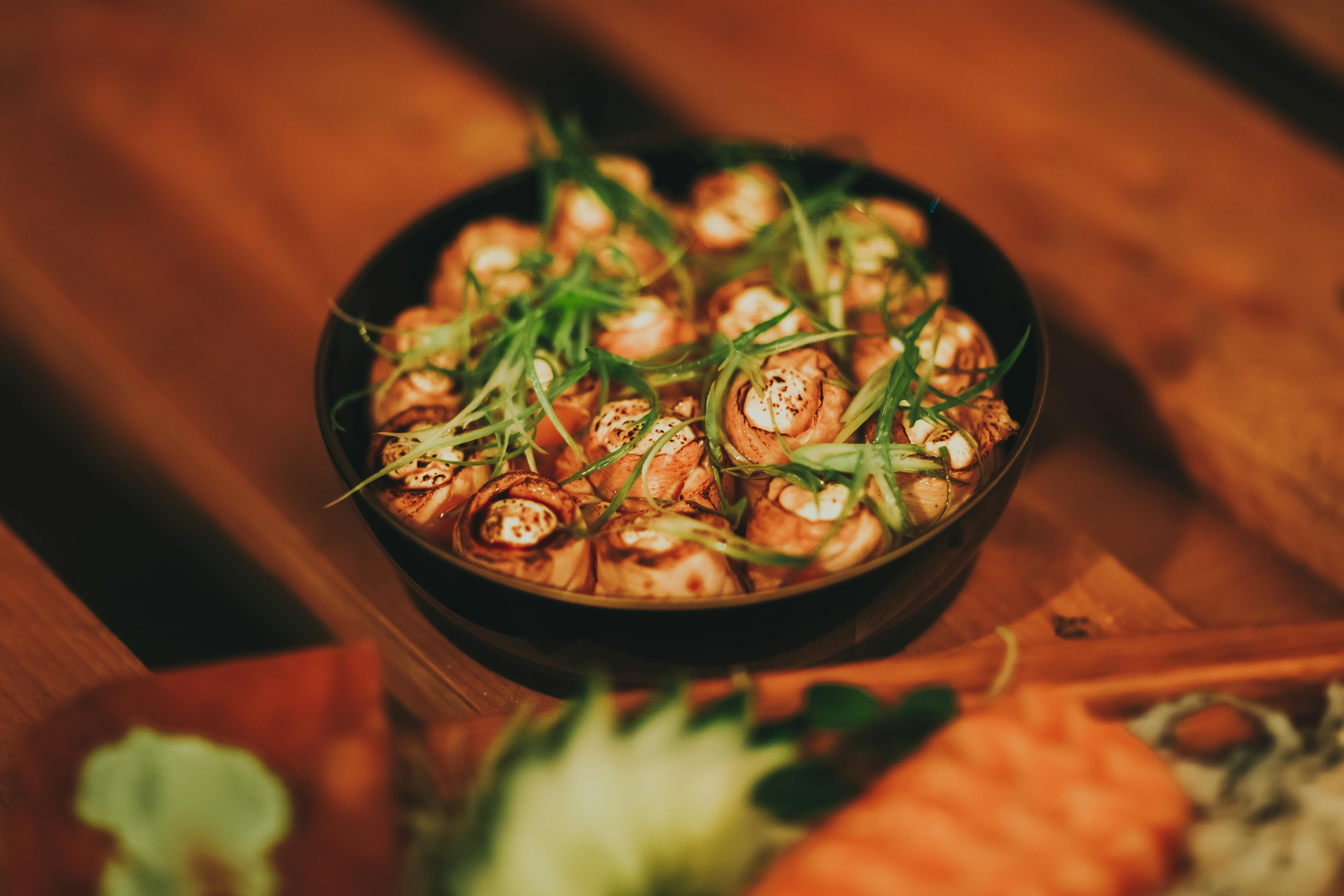 mushroom dish on black ceramic bowl