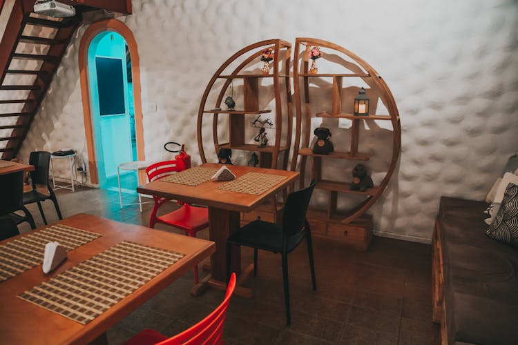 Round Wooden Bookshelf In Empty Restaurant