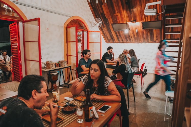 People Eating In Restaurant