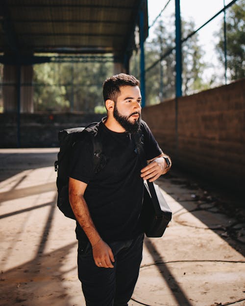 Bearded Man with a Backpack Looking Afar