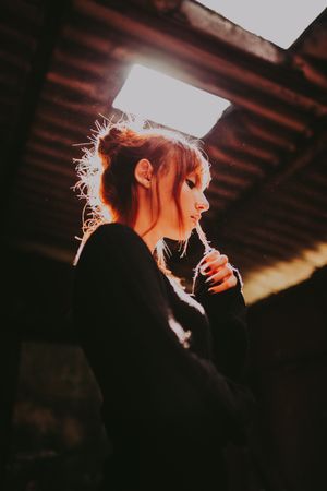 Backlit figure in an underground space — photo by Matheus Bertelli on Pexels