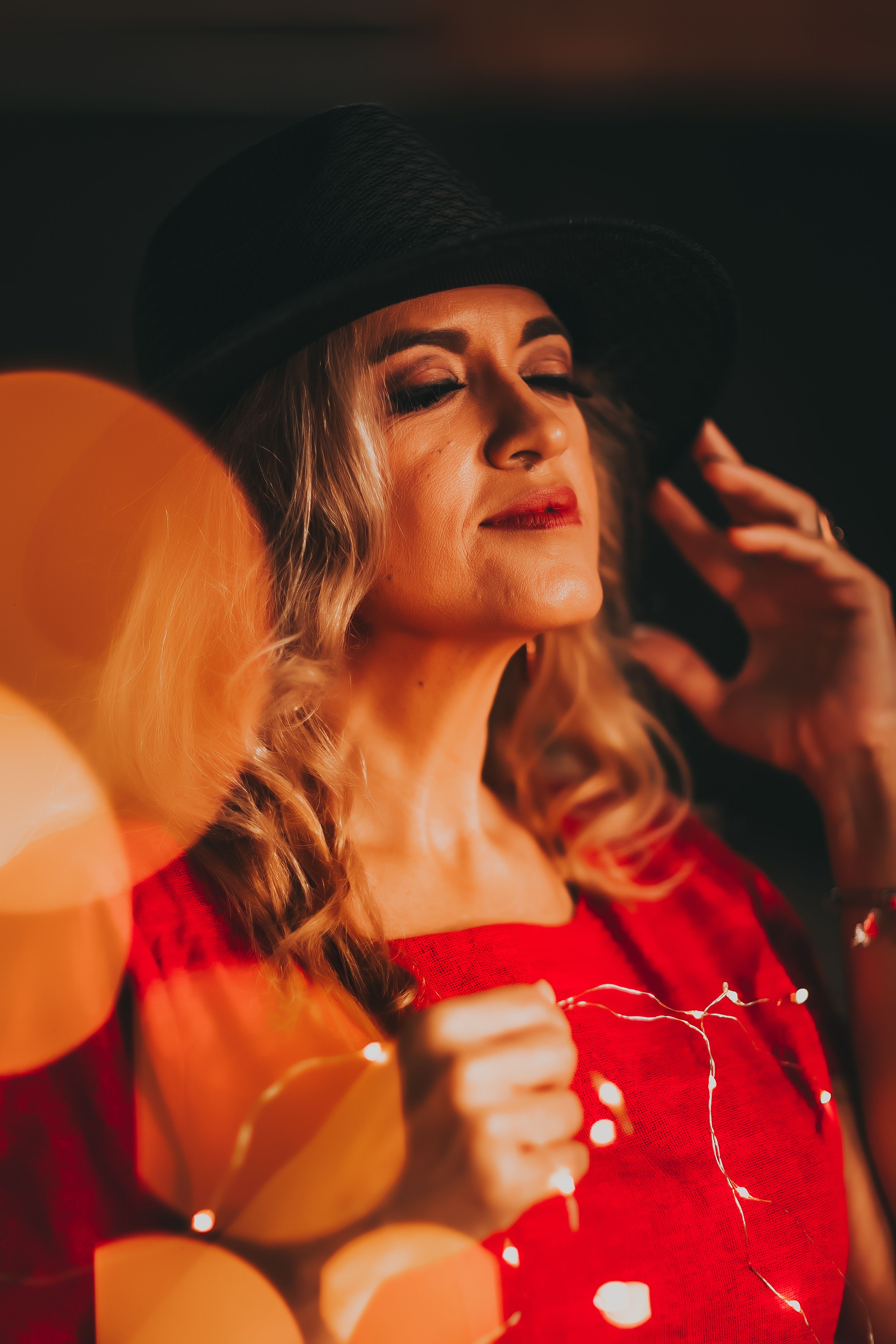 Woman Wearing a Red Dress and Black Hat · Free Stock Photo