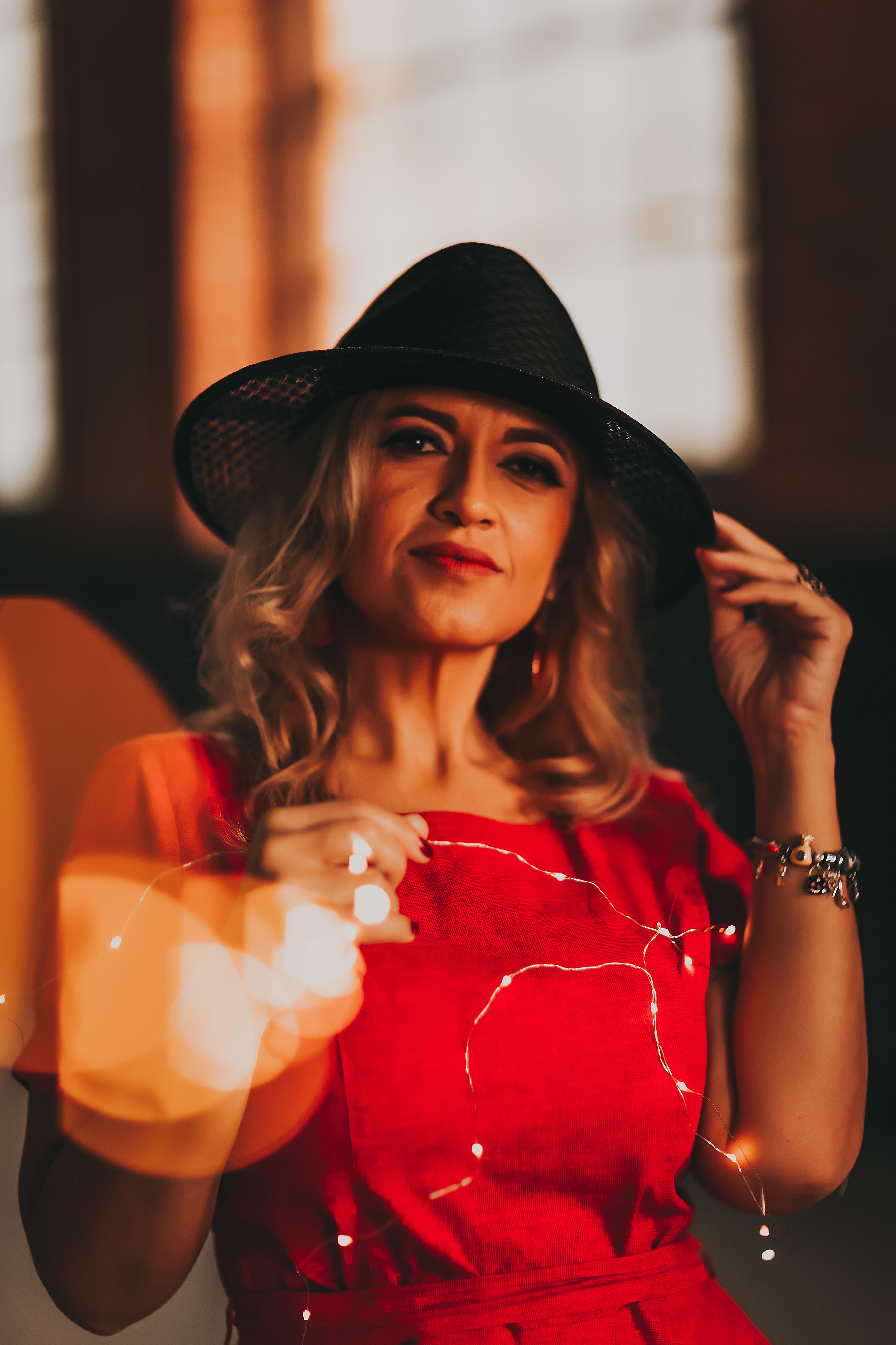 Woman in a Red Dress and Black Hat · Free Stock Photo