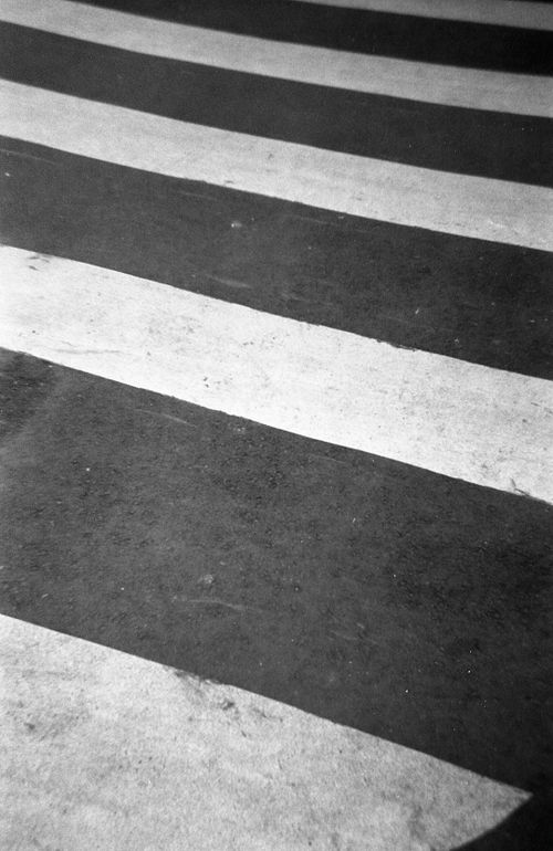 Free Black and white abstract view of a zebra crossing, focusing on patterns. Stock Photo