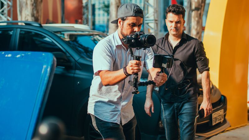 Camera operator filming on a production set