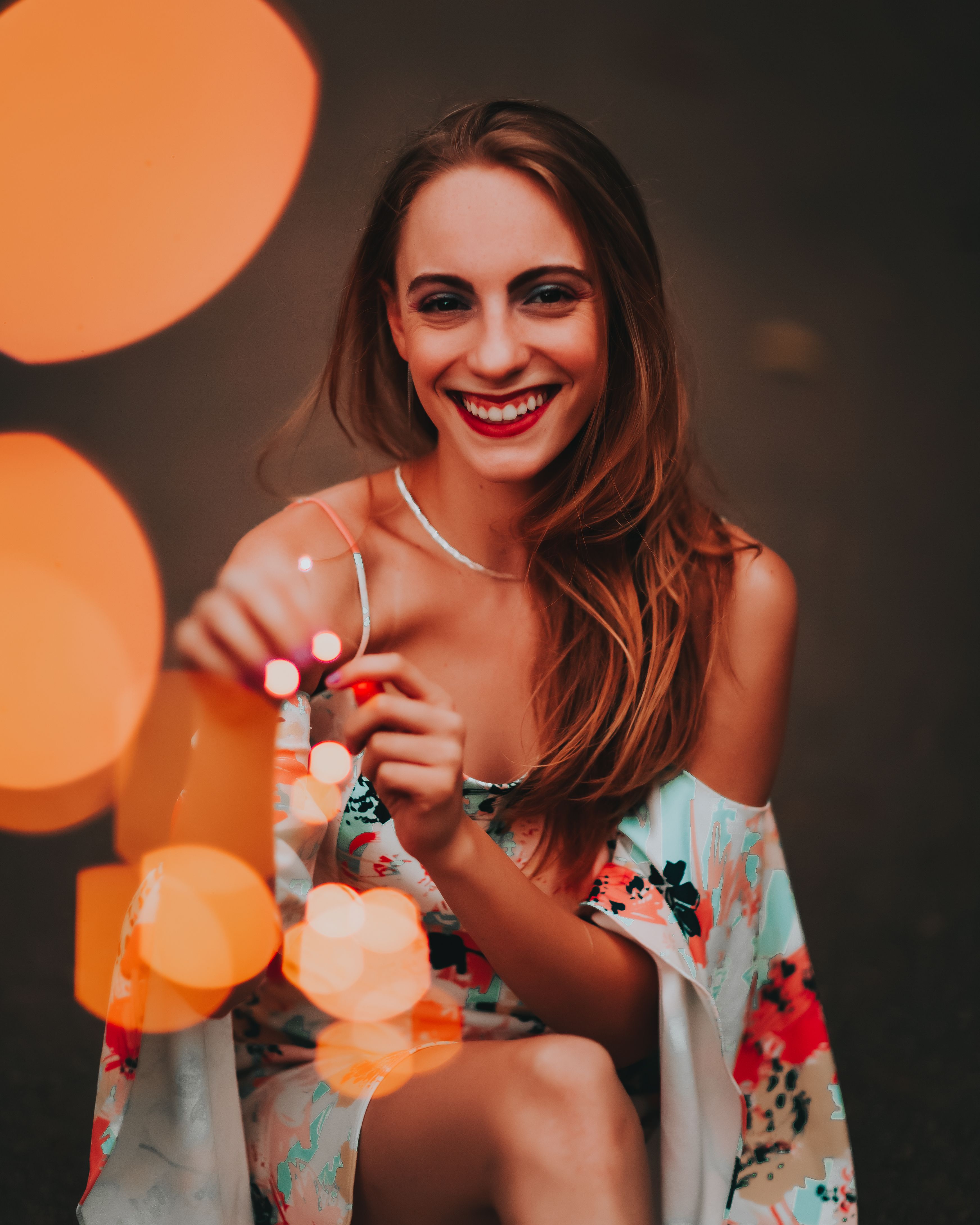 Beautiful Woman in Floral Dress Smiling · Free Stock Photo