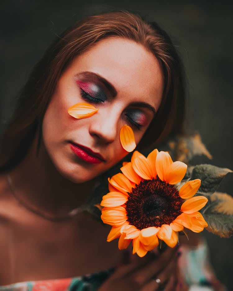 Woman With Sunflower Petals On Face