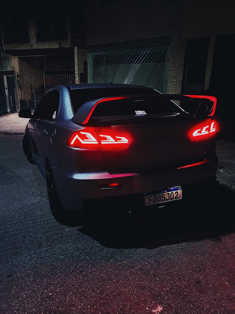 Car Rear Lamps Lit Up At Night