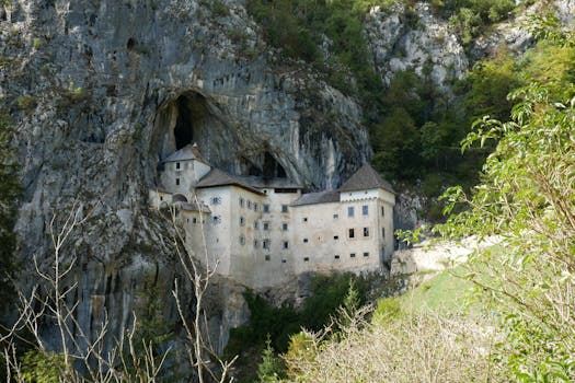 Discover the stunning Predjama Castle built into a cliffside cave in Slovenia.